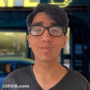 Man Wearing Glasses And Black Shirt In Front Of Cafe Sign GIF