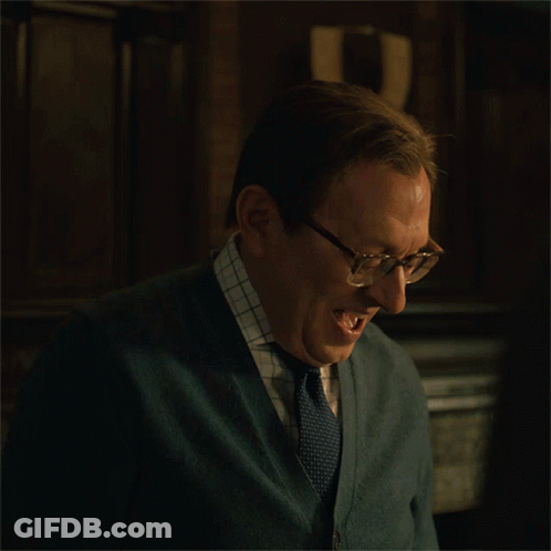 Man Wearing Glasses And Cardigan Laughing GIF