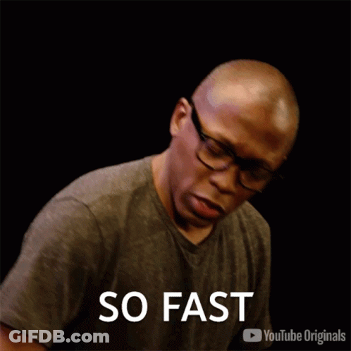 Man Wearing Glasses And Gray Shirt Saying Fast GIF