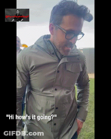 Man Wearing Glasses And Gray Shirt Saying Hi GIF
