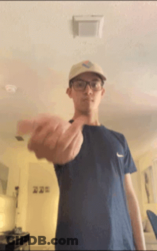 Man Wearing Glasses And Hat Flipping Off GIF