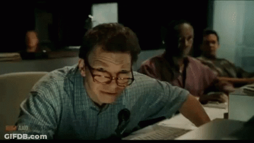 Man Wearing Glasses And Headphones At Desk GIF