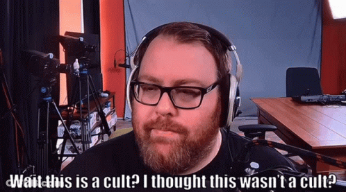 Man Wearing Glasses And Headphones Says Cult GIF