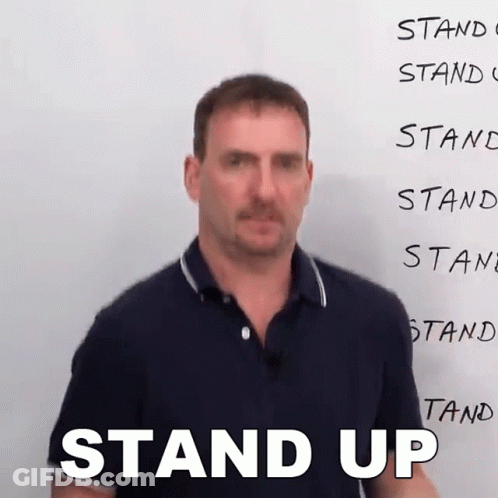 Man Wearing Glasses And LC Sign Shirt GIF