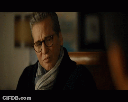 Man Wearing Glasses And Scarf Looking GIF