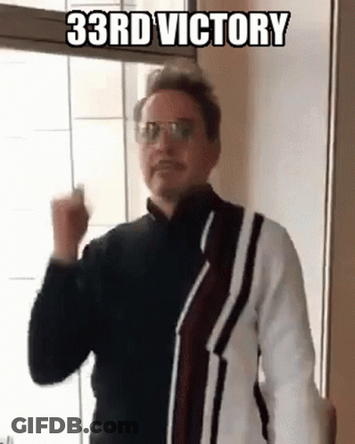 Man Wearing Glasses And Sweater Making Fist GIF