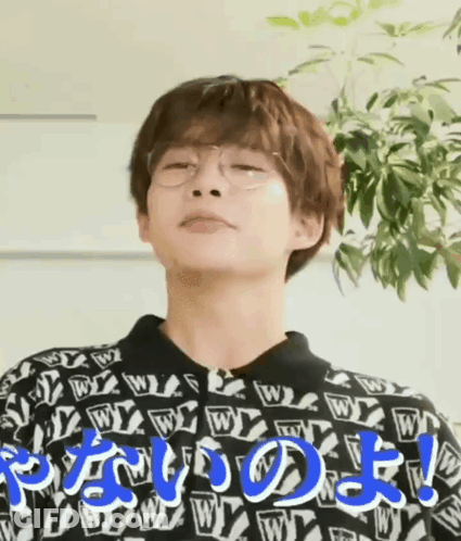 Man Wearing Glasses And Sweater With Letter W Making Funny Face GIF