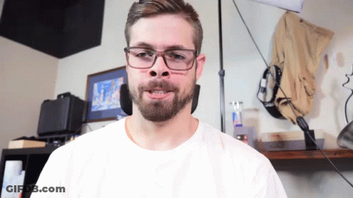 Man Wearing Glasses And White Shirt Making A Face GIF