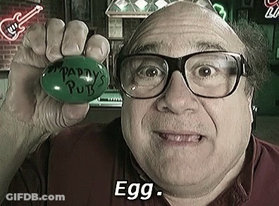 Man Wearing Glasses Holding Green Egg GIF