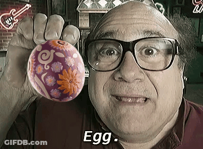 Man Wearing Glasses Holding Purple Easter Egg GIF