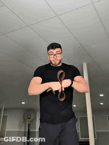 Man Wearing Glasses Holding Snake GIF