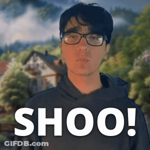 Man Wearing Glasses In Front Of Shoo Sign GIF