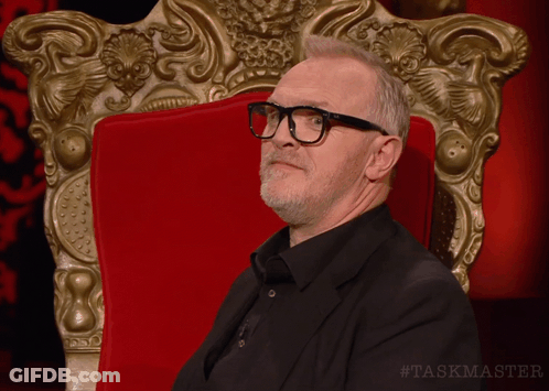Man Wearing Glasses In Red Chair GIF