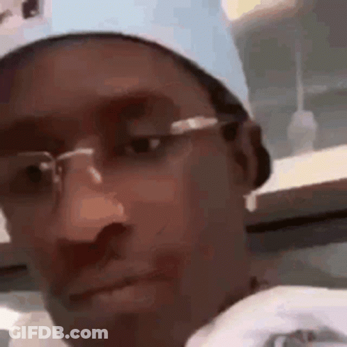 Man Wearing Glasses Looking At Camera GIF