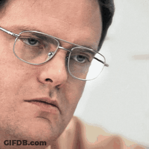 Man Wearing Glasses Looking At Camera GIF