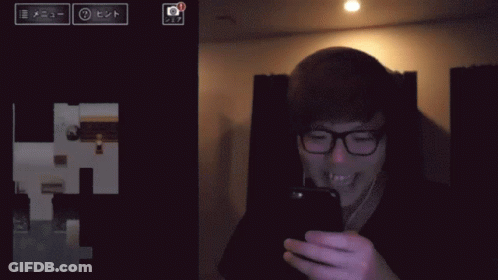 Man Wearing Glasses Looking At Cell Phone GIF