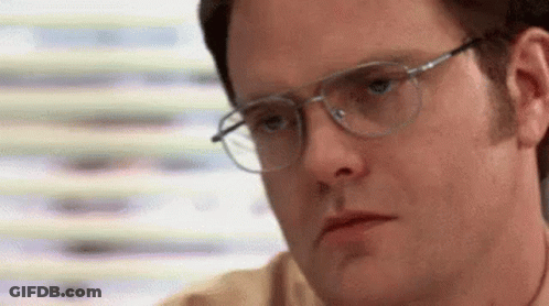 Man Wearing Glasses Making Serious Face GIF