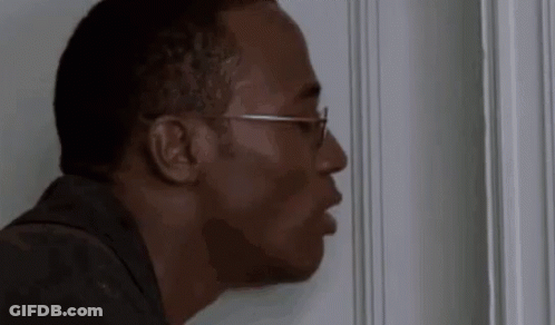 Man Wearing Glasses Peeking Out Of Door GIF
