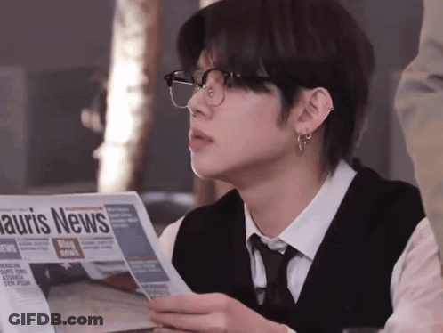 Man Wearing Glasses Reading Auris News GIF