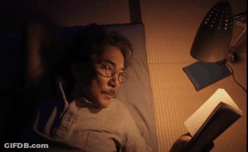 Man Wearing Glasses Reading Book GIF