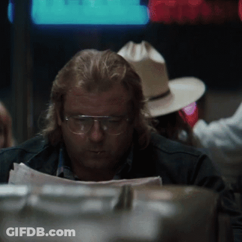 Man Wearing Glasses Reading Paper GIF