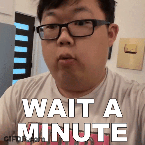 Man Wearing Glasses Says Wait A Minute GIF