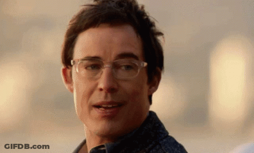 Man Wearing Glasses Smiling At Camera GIF