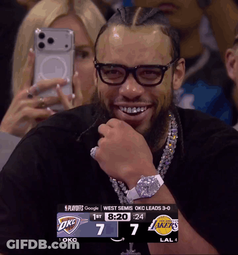 Man Wearing Glasses Smiling At Scoreboard GIF