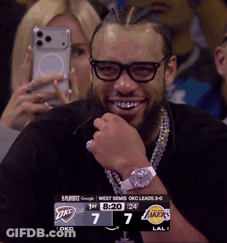 Man Wearing Glasses Smiling At Scoreboard GIF