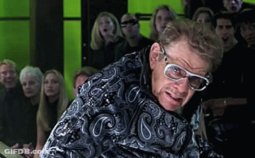 Man Wearing Glasses Standing In Crowd GIF