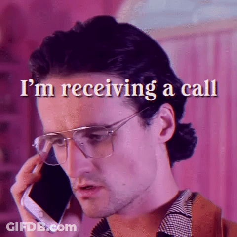 Man Wearing Glasses Talking On Phone GIF