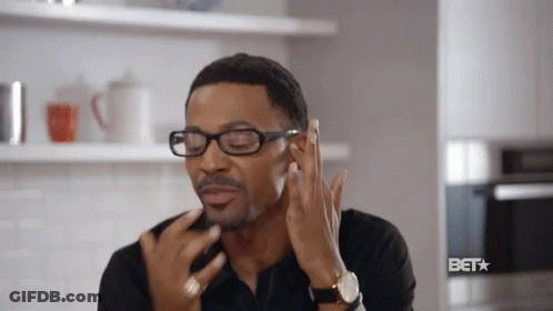 Man Wearing Glasses Touching Face GIF
