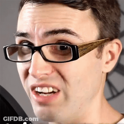 Man Wearing Glasses With Wooden Frames GIF