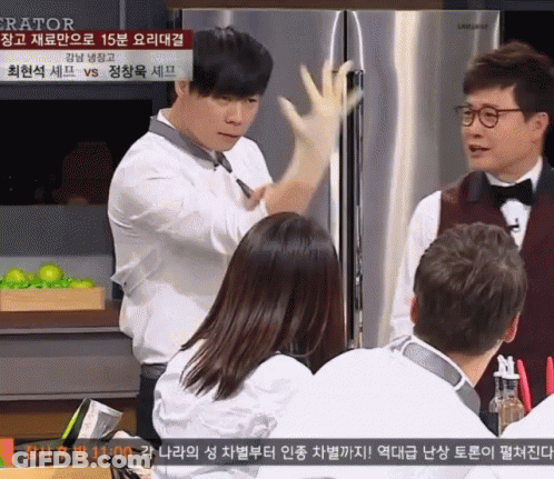 Man Wearing Glove In Front Of Refrigerator GIF