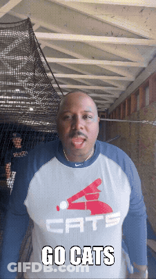 Man Wearing Go Cats Shirt GIF