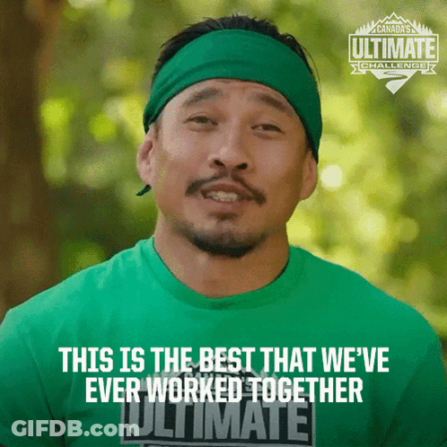 Man Wearing Green Shirt That Says Ultimate GIF
