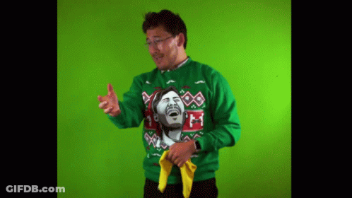 Man Wearing Green Sweater With Laughing Face GIF