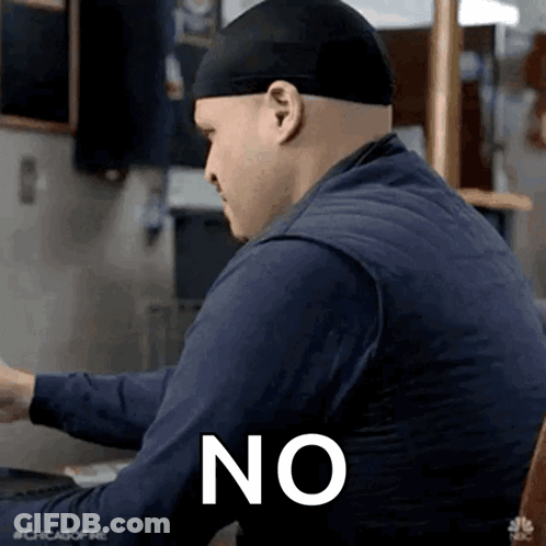 Man Wearing Hat And Blue Shirt Sitting At Table With Word No GIF