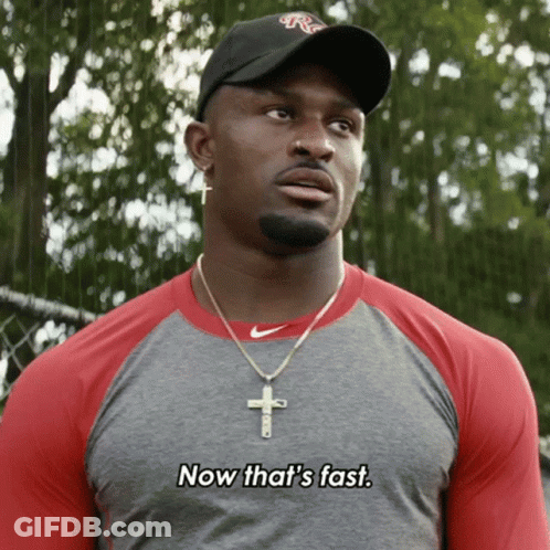 Man Wearing Hat And Cross Necklace Says Now That's Fast GIF