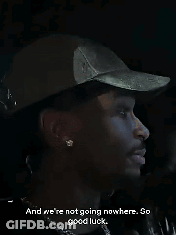 Man Wearing Hat And Earrings Saying Good Luck GIF