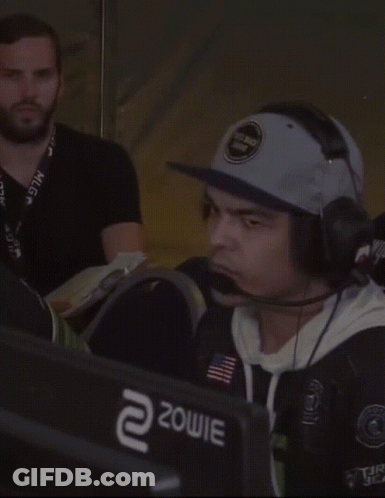 Man Wearing Hat And Headphones In Front Of Zowie Monitor GIF