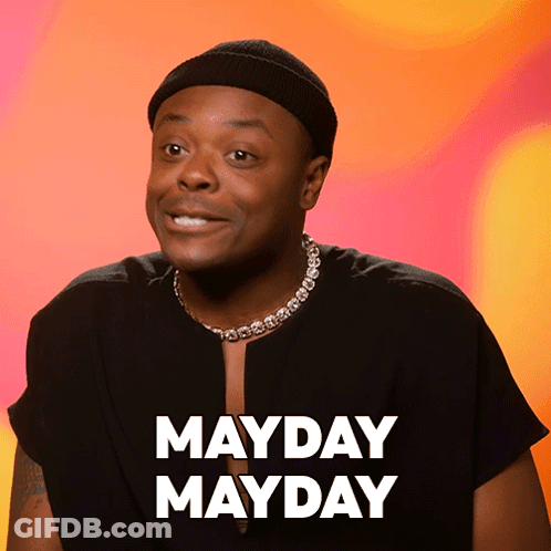 Man Wearing Hat And Mayday Mayday Necklace GIF