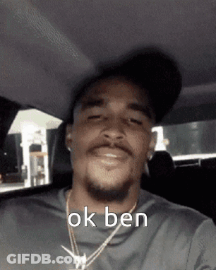 Man Wearing Hat And Necklace In Car GIF