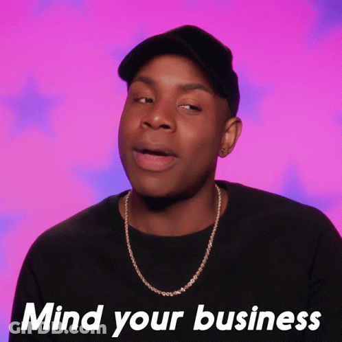 Man Wearing Hat And Necklace Saying Mind Your Business GIF