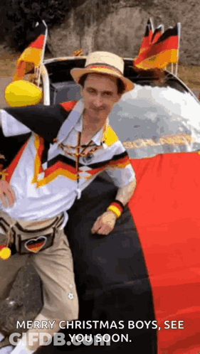 Man Wearing Hat In Front Of Car With German Flags GIF