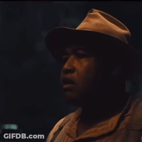 Man Wearing Hat Looking Sideways GIF