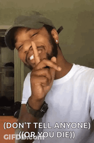 Man Wearing Hat Making Shhh Sign GIF