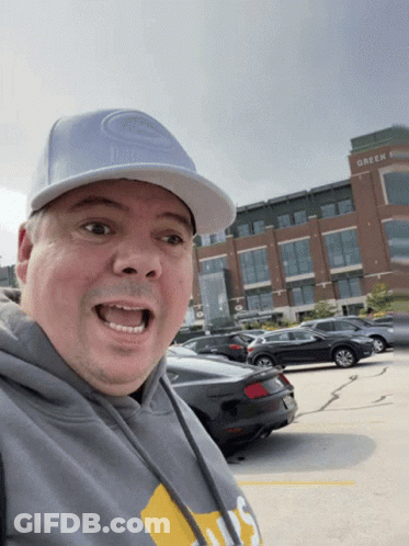 Man Wearing Hat Saying Green Bay GIF