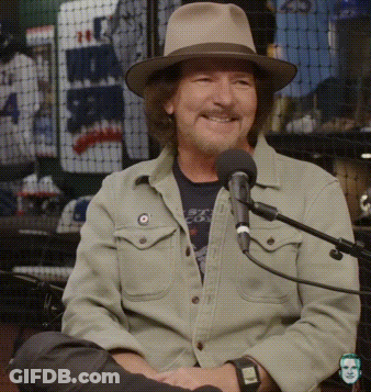 Man Wearing Hat Sitting At Microphone GIF