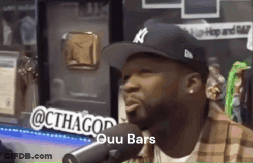 Man Wearing Hat Talking Into Microphone GIF